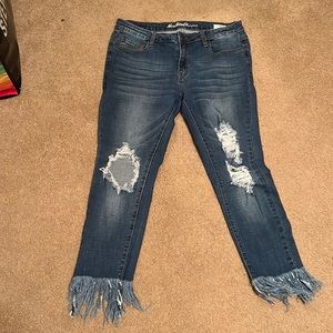 Distressed fringe jeans